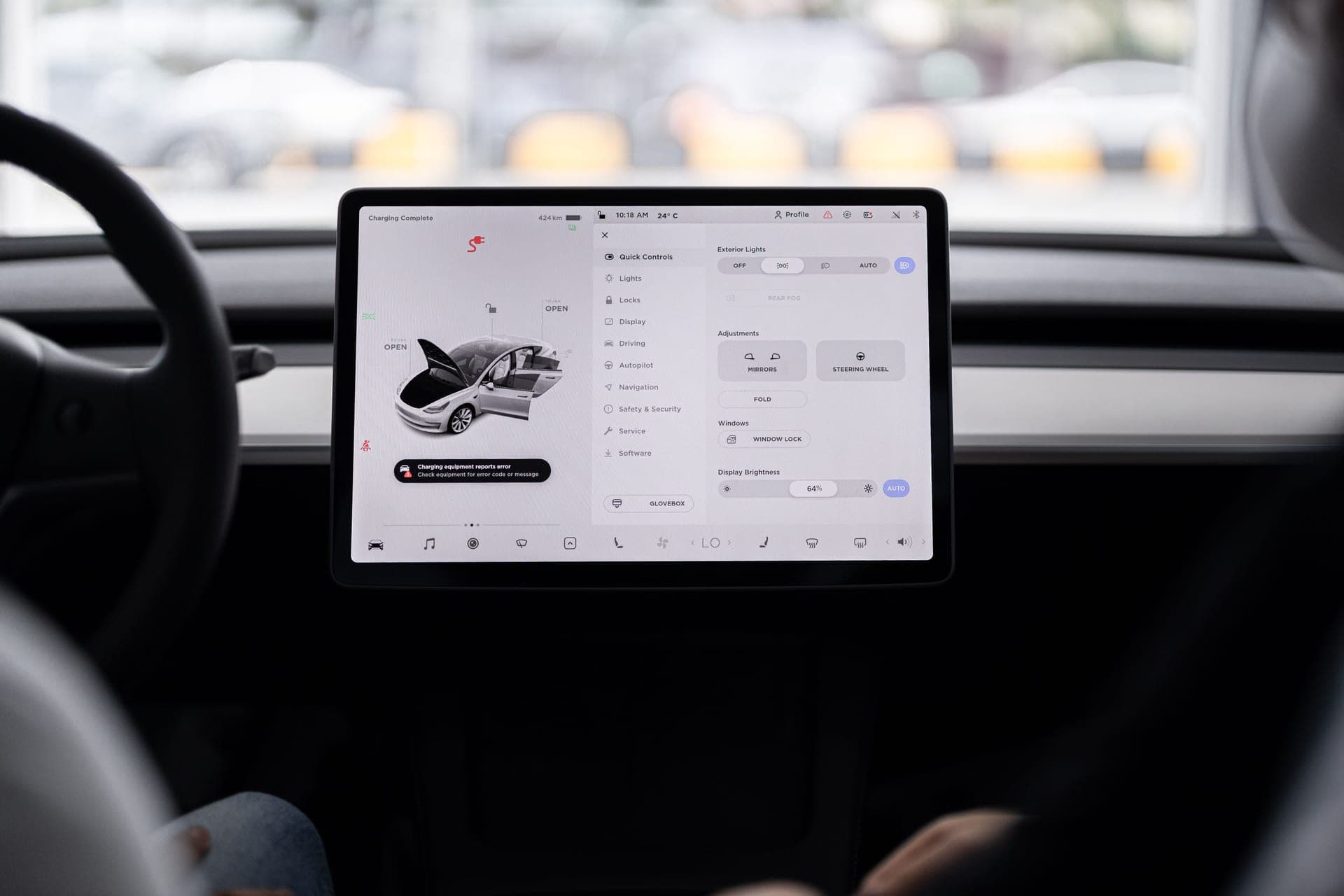 An electric vehicle dashboard showing charging status and range