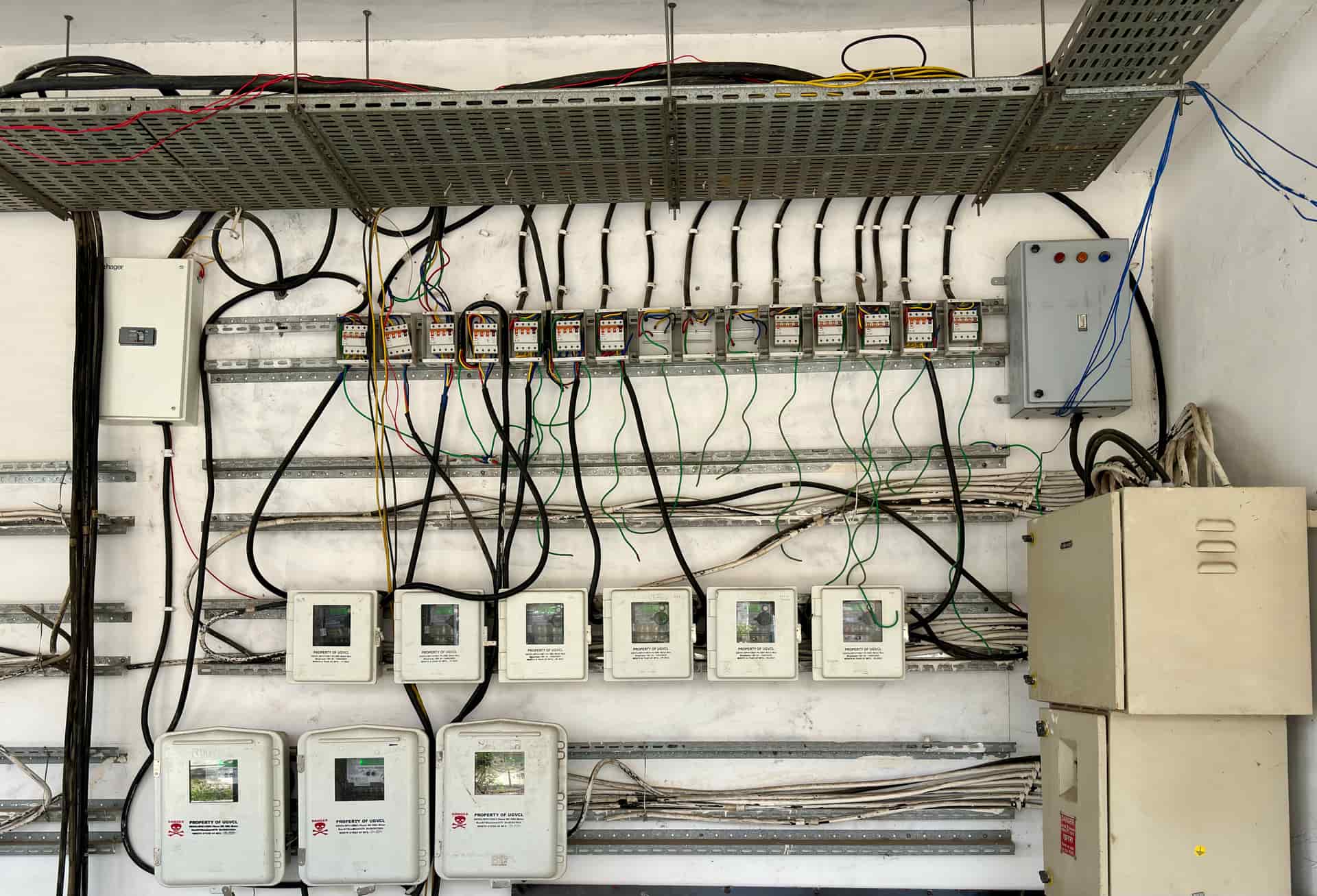 An open residential electrical panel showing circuit breakers
